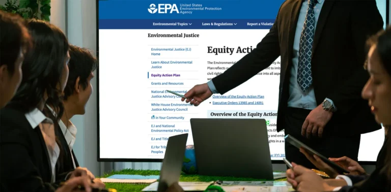A big screen shows EPA website in a business meeting.