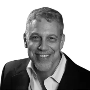 Larry Schnapf in black blazer and white shirt