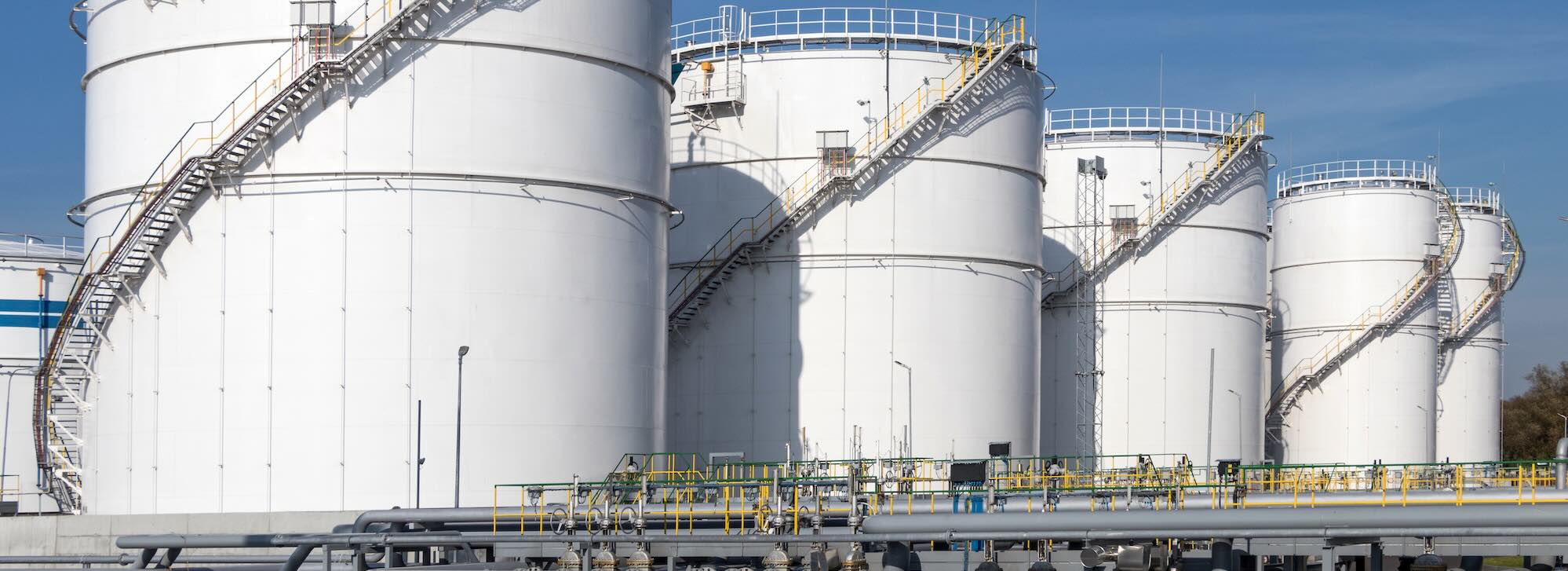 Oil storage tanks and pipes at the oil terminal